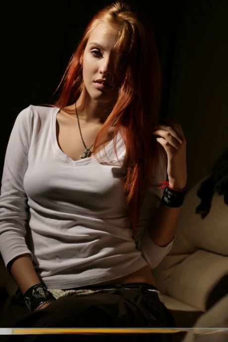 Hot redhead Kira W sets her flawless teen body free in poor light 75901810