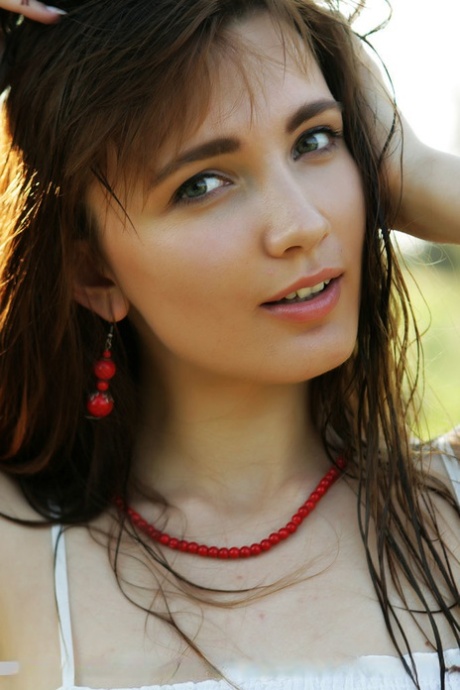 Teen girl with pretty face heads into the woods to catch rays on her nude body 10527010