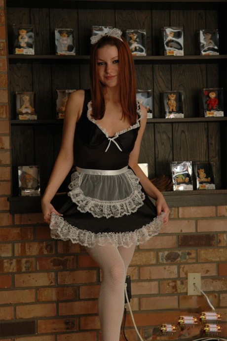 Redheaded maid Korina Bliss takes off her uniform in a teasing manner 22314772