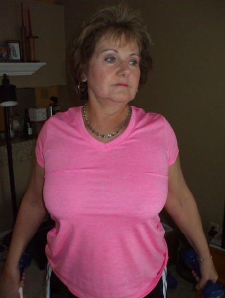 Mature woman Busty Bliss exposes her natural boobs while working out at home 19760226