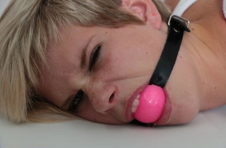 We girl with short on hair struggles against rope bindings while ball gagged 43494649