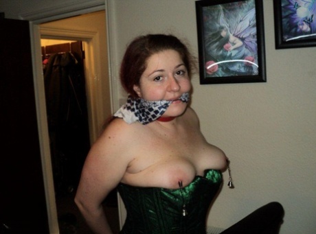 Chubby redhead sports a cleave gag with her wrists handcuffed behind her back 87817293