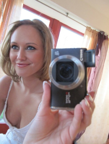 Blonde amateur takes mirror selfies while getting naked in heels 79978821