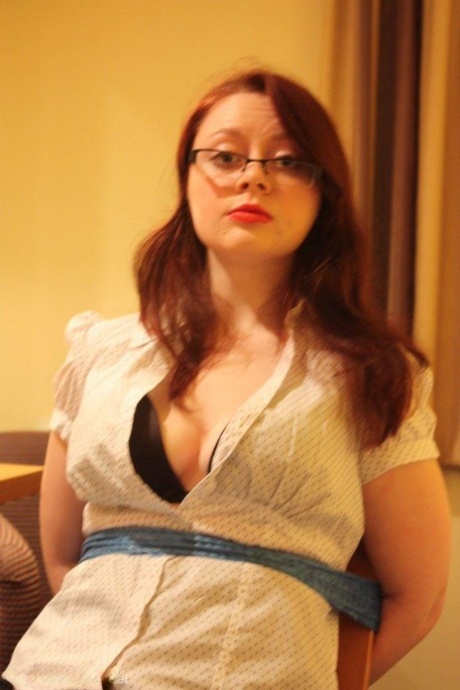 Redhead secretary struggles against rope restraints while tied to a chair 28737145