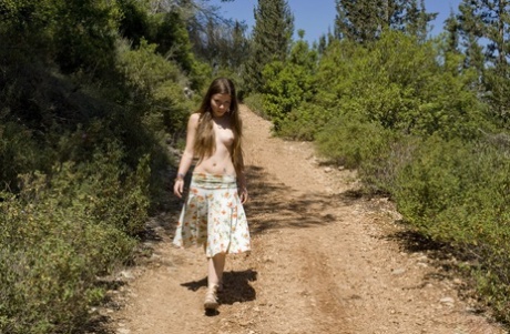 Barely legal girl with a sexy ass gets naked on a road in the woods 61284737