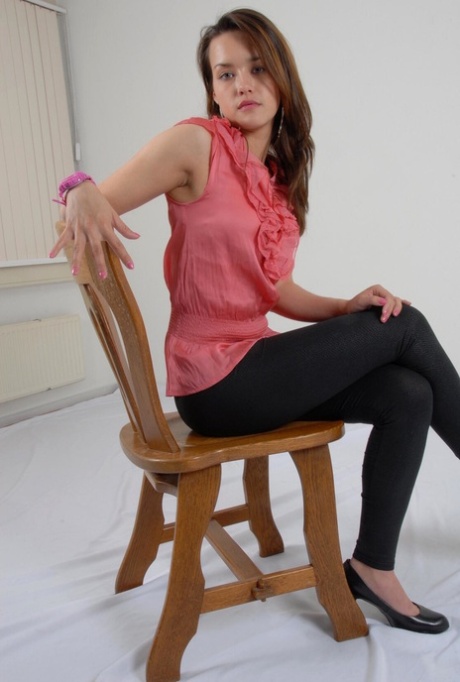 Caucasian female Alice admires her pink G-Shock watch while fully clothed 66765885