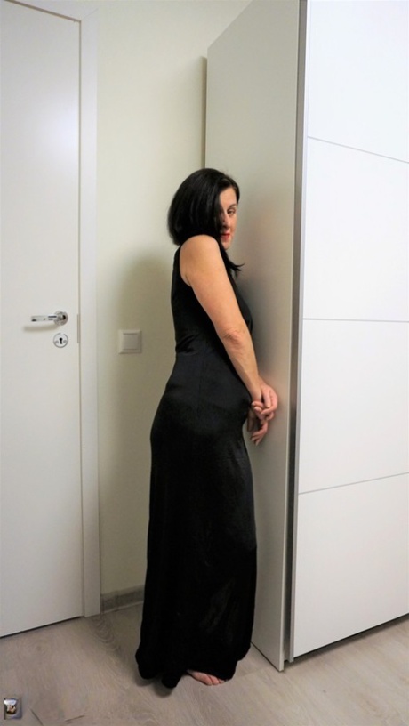 Dark-haired lady Diana Ananta hikes up her long dress to show her trimmed cunt 86571079