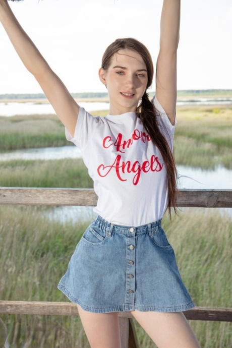 Nice teen Ernesta gets naked in over the knee sports socks at a lookout spot 26054365