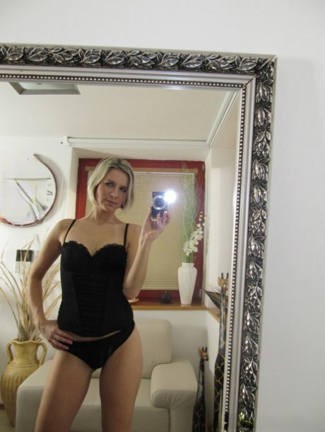 Blonde babe in lingerie Bianca Ferrero stripping in front of the mirror 20095012